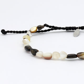 Close up of a dark mother of pearl beaded bracelet on a white background
