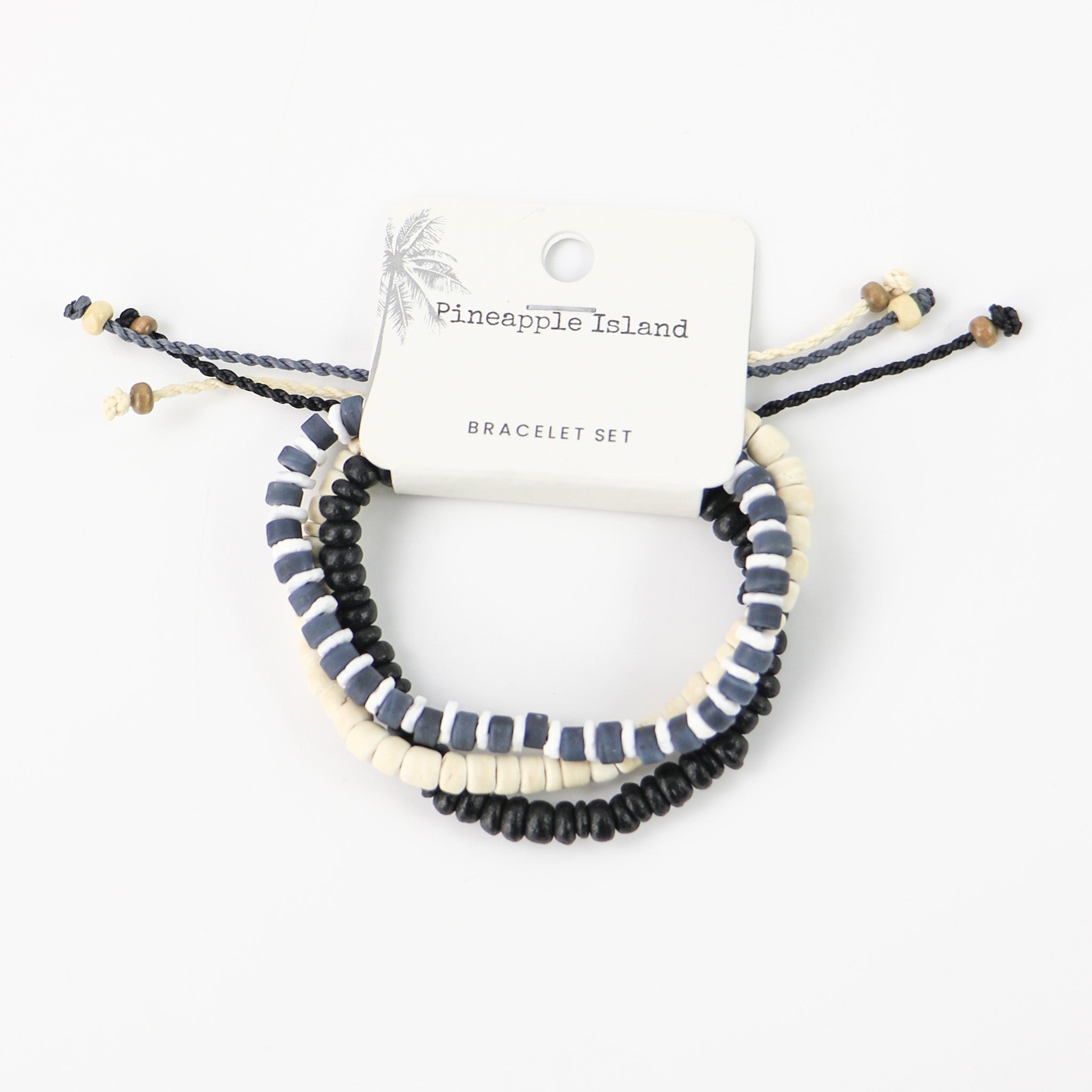 Our Ala Moana Beach bracelet set, featuring three beaded surf bracelets made with coconut beads, frosted glass, white puka shell and our durable wax polyester cord. In this set you get three individual bracelets sold together for the perfect stack. Bracelets are black, grey and natural beige colour.