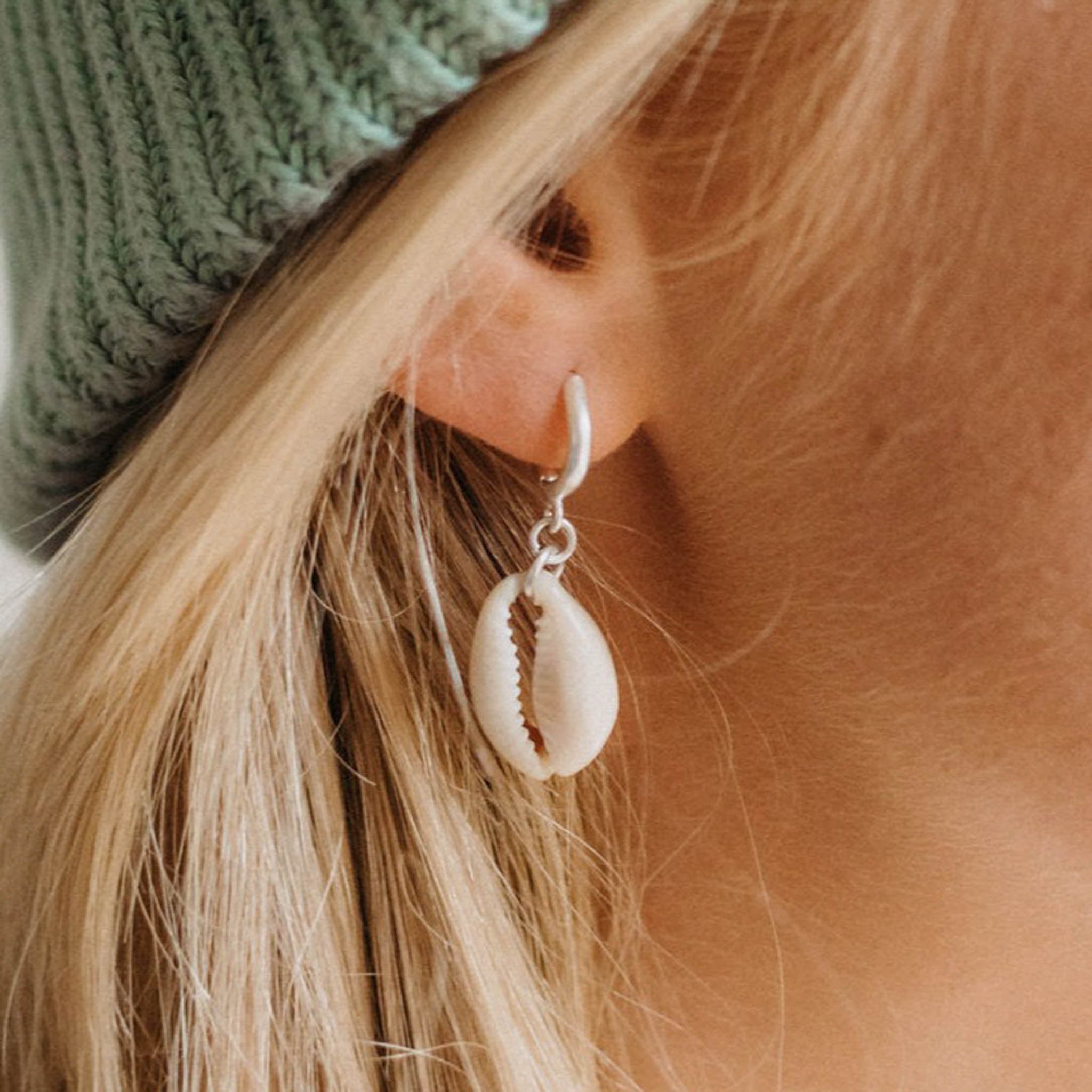 Asri Cowrie Shell Earrings with a silver plated copper alloy huggie hoop - Pineapple Island