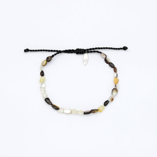 dark mother of pearl beaded bracelet on a white background
