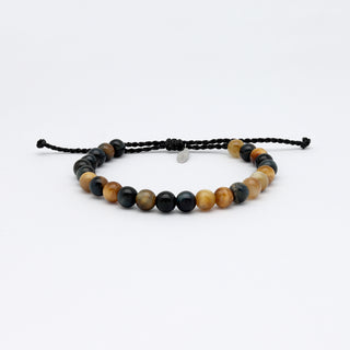 A gemstone beaded bracelet in tones of brown and black, on a white background