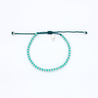 Turquoise beaded bracelet on a white background