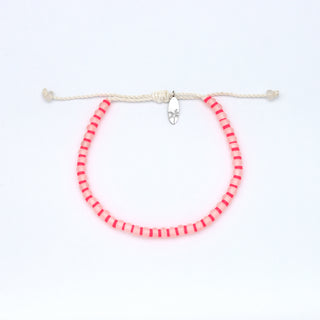 Bright pink bracelet on a white background