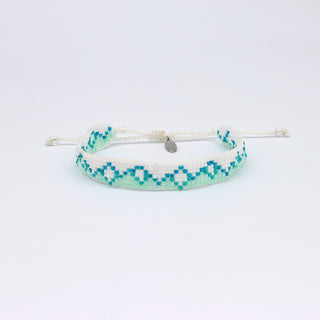 Bracelet with blue and white mountain pattern on a white background