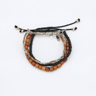 Set of beaded bracelets with wooden beads on a white background