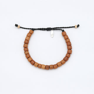 Chunky warm brown wooden beaded bracelet on a white background
