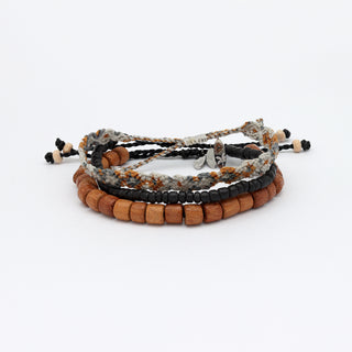 Set of beaded bracelets stacked up on a white background