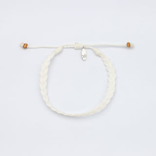 White braided bracelet with wooden beads on a white background