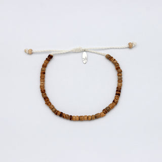 Beaded bracelet with wooden beads on a white background