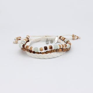 Set of three beaded bracelets stacked up on a white background
