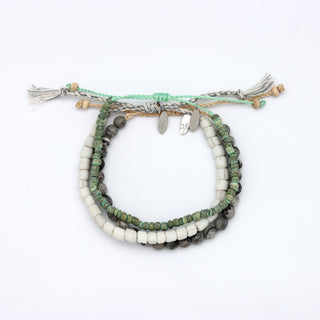 Set of three beaded bracelets on a white background