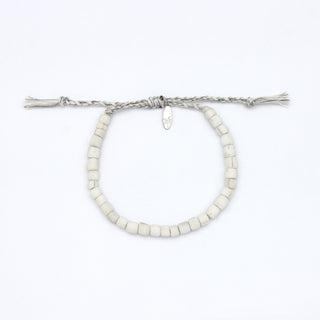 White beaded bracelet on a white background