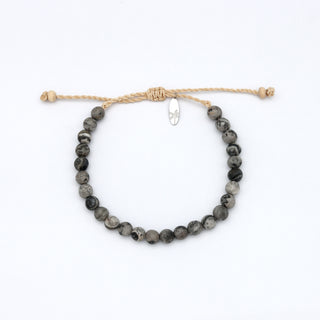Bracelet with gray beads on a white background