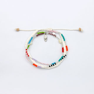 Multicolored beaded bracelet, and white beaded bracelet on a white background