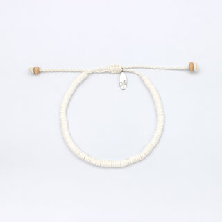 White beaded bracelet on a white background