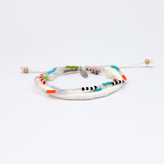 Multicolored beaded bracelet and white beaded bracelet on a white background