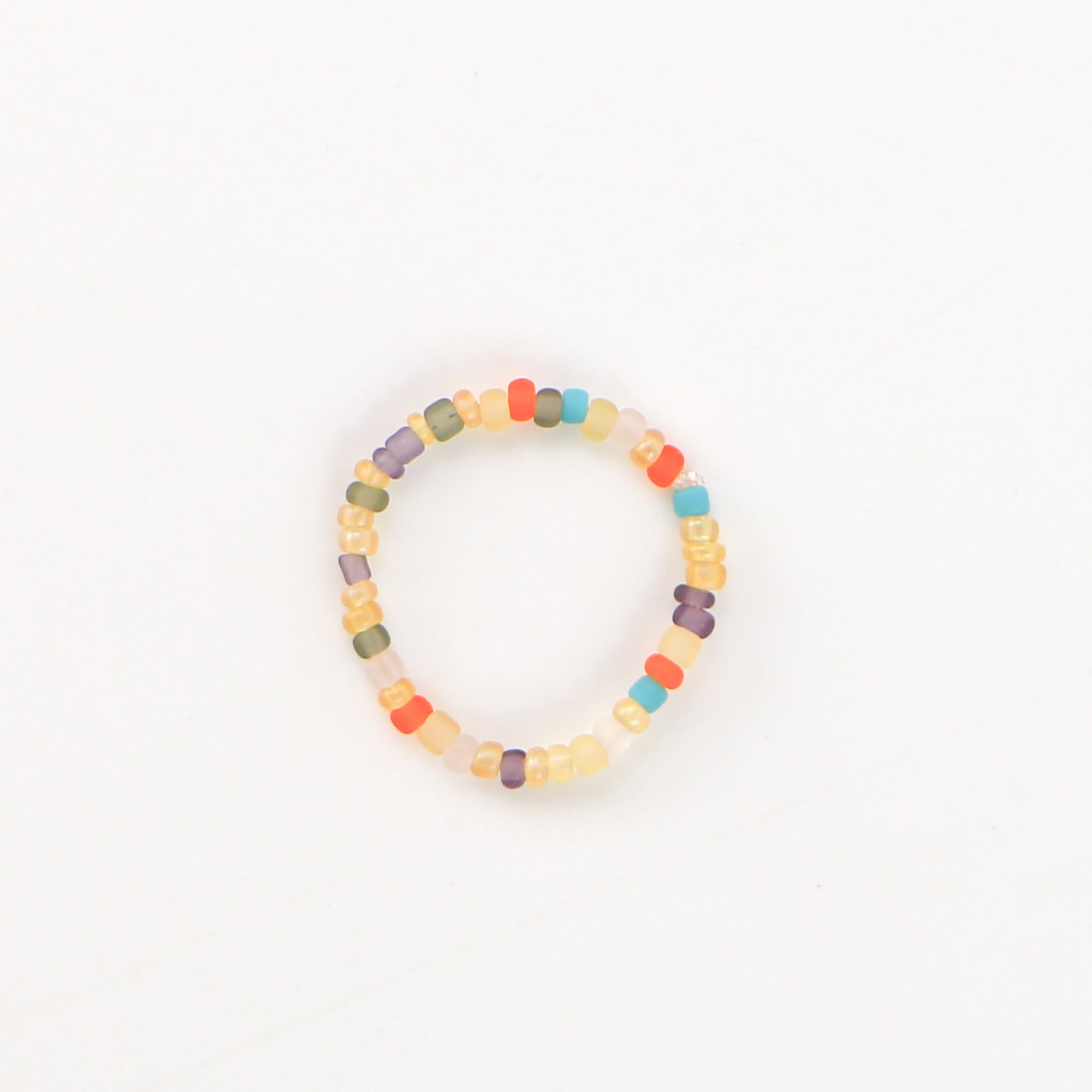 Warm tone Colourful Beaded Stretchy Ring in oranges, browns and turquoise. Stretchy ring by Pineapple Island.