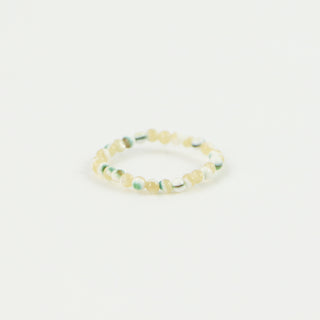 Natural and green tone beaded stretchy ring