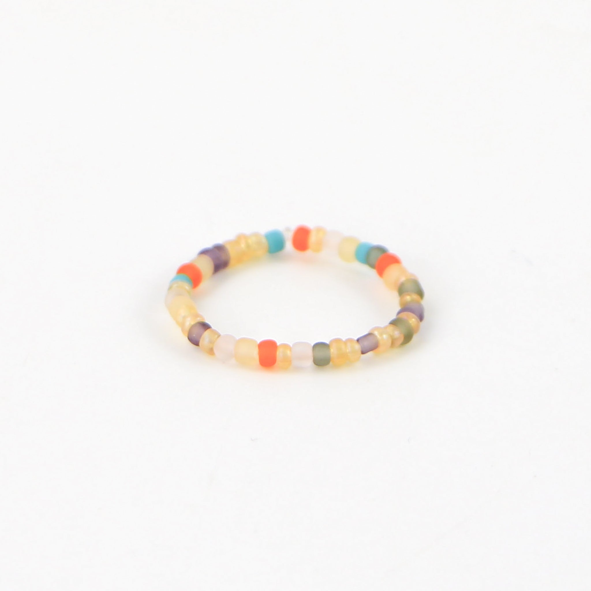 Warm tone Colourful Beaded Stretchy Ring in oranges, browns and turquoise. Stretchy ring by Pineapple Island.